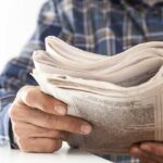 Man holding newspaper