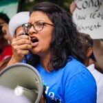 Rashiba Tlaib on a megaphone address system