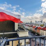 Polish flag on a rooftop in Warsaw, Poland