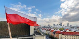 Polish flag on a rooftop in Warsaw, Poland