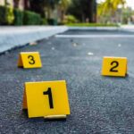 crime scene with yellow and black markers