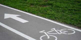 image of a bicycle path and a directional arrow
