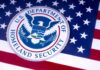 Department of Homeland Security emblem on American flag.