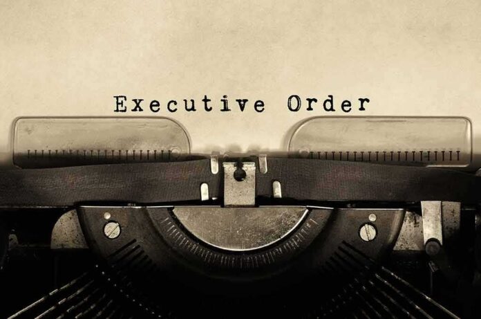 604652078 featured image Typewriter typing "Executive Order" on paper.