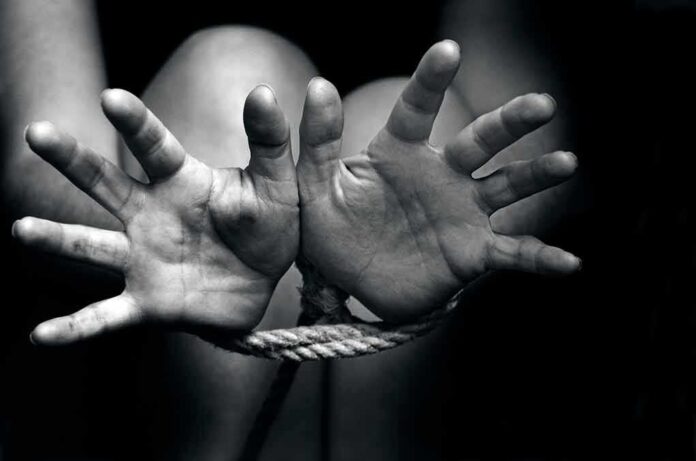 146428184 featured image Two hands tied with rope in black and white