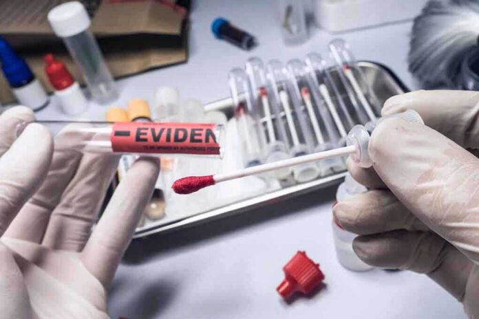 1701288700 featured image Gloved hands holding evidence tube and cotton swab.