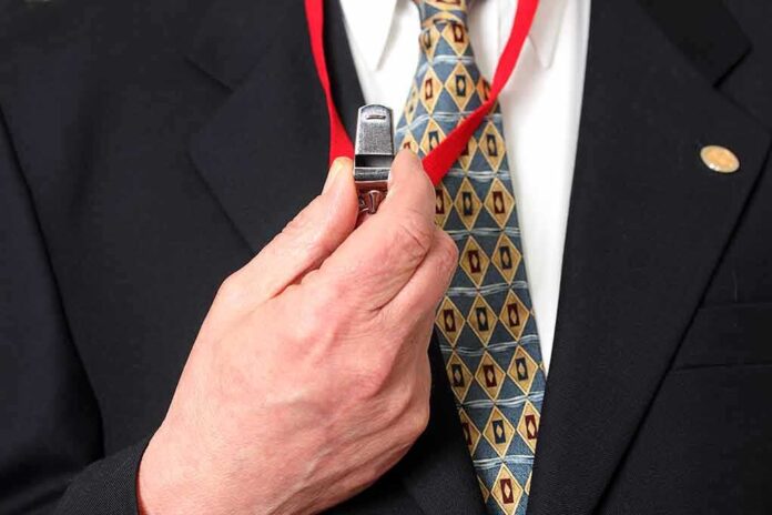 373781791 featured image Person holding a whistle on a red lanyard.