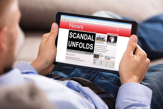 686343781 featured image Person reading tablet with headline scandal unfolds