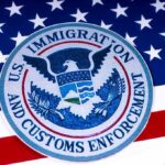 US Immigration and Customs Enforcement badge on flag