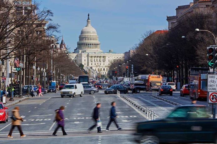 1081016648 featured image People crossing street near the U.S. Capitol building.