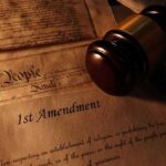 First Amendment document with gavel and Constitution background