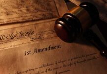 First Amendment document with gavel and Constitution background