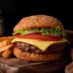 Robert F. Kennedy Jr.’s Role in Revolutionary Health Policy Shifts Cheeseburger with fries on a wooden board.