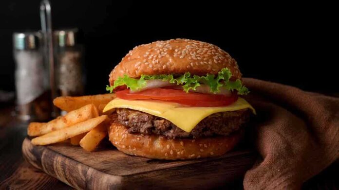 1673677534 featured image Cheeseburger with fries on a wooden board.