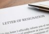 Resignation letter with a pen on top