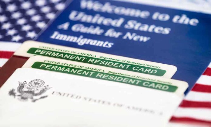 Permanent resident cards with welcome guide and flag.