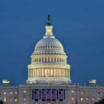 Ethical Questions Surround Ken Paxton’s Campaign: Public Resources Under Scrutiny U.S. Capitol building illuminated at dusk.