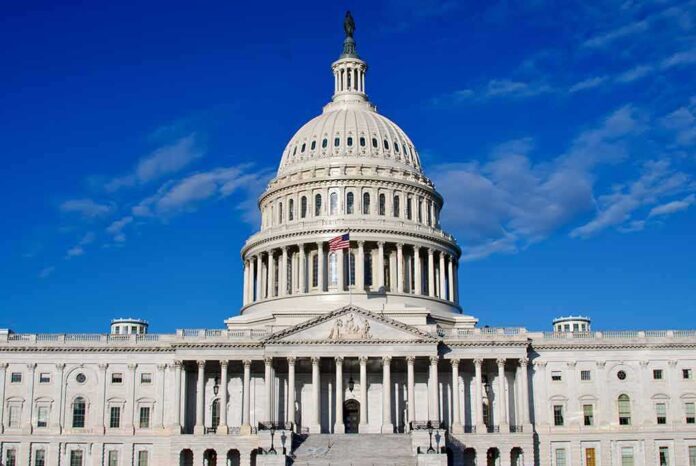 2406965967 featured image US Capitol Building against blue sky.