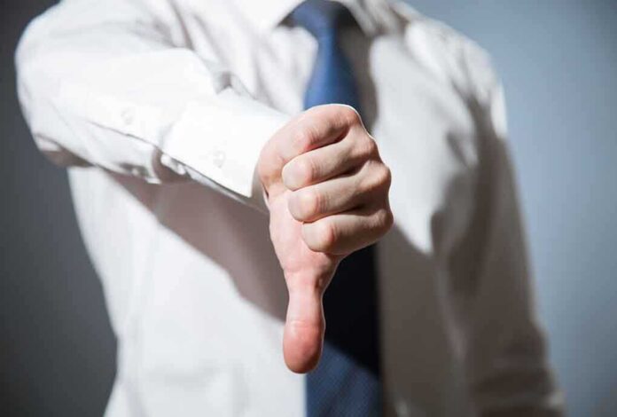 314376254 featured image Person giving a thumbs down gesture.