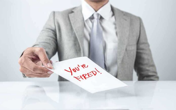 483667948 featured image Person handing a paper with Youre Fired text.