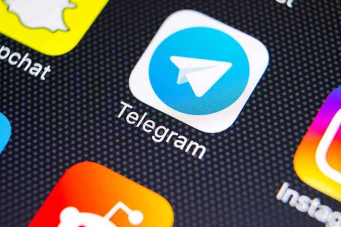 1023930217 featured image Telegram app icon on a smartphone screen.