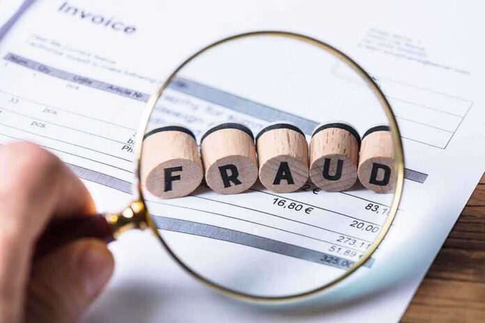 1042804675 featured image Magnifying glass showing fraud on an invoice.