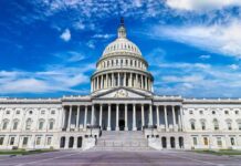 U.S. Capitol building with clear blue sky background.