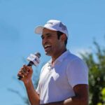 vivek holding a mic