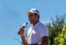vivek holding a mic