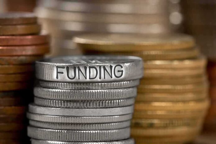 784896787 featured image Stack of coins labeled funding with other coins stacks