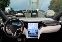 Car interior with self-driving mode on highway.