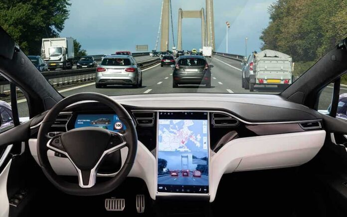 1174395055 featured image Car interior with self-driving mode on highway.