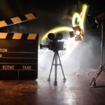 news set up with clapperboard camera and lighting
