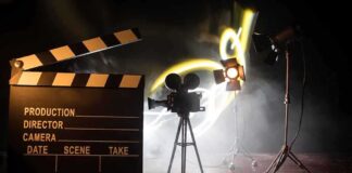 news set up with clapperboard camera and lighting