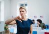Woman with thumbs down in voting location