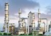 Industrial Natural Gas plant with metal towers and pipes