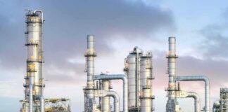 Industrial Natural Gas plant with metal towers and pipes