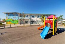 Colorful playground slide in front of a building