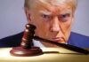 Gavel in front of a serious man's face