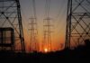 Transmission towers at sunset