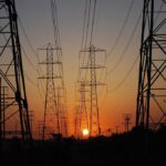 Transmission towers at sunset