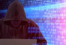 Person in hoodie using laptop, surrounded by digital code.