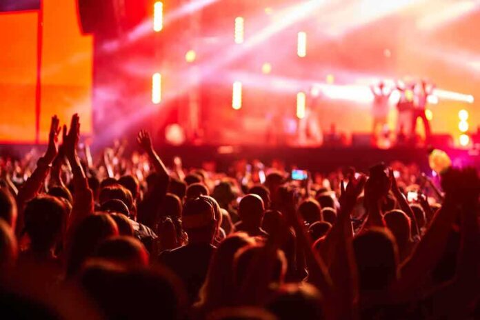 2454781497 featured image Crowd at concert with vibrant stage lights