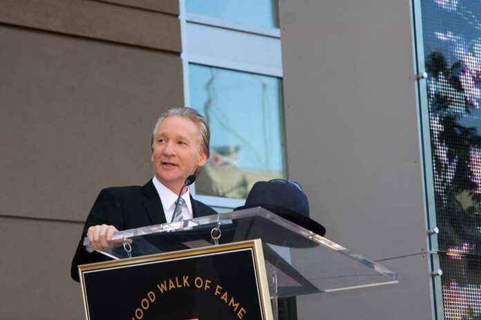 A man in formal attire speaking at a podium during a Hollywood Walk of Fame ceremony