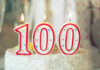 Candles shaped as 100 on a cake.