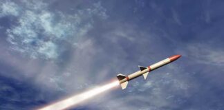 A missile ascending into the sky with a trail of smoke