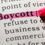 Hollywood Bombshell: Boycott Sparks Fierce Debate Highlighted definition of the word 'boycott' in a dictionary