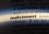 Close-up of a dictionary page showing the word indictment and its definition