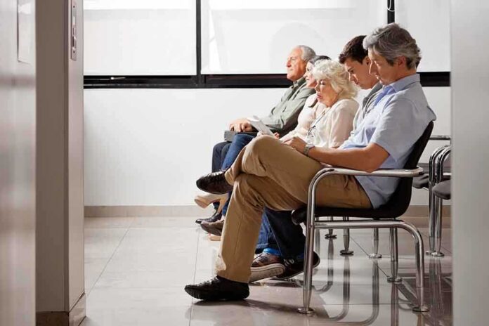 A diverse group of patients sitting in a waiting room