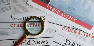 Newspapers with Cyber Attack headlines and a magnifying glass.